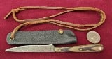 Damascus Steel Knife with a Composite handle with leather protective cover and leather cord. 6.5" L