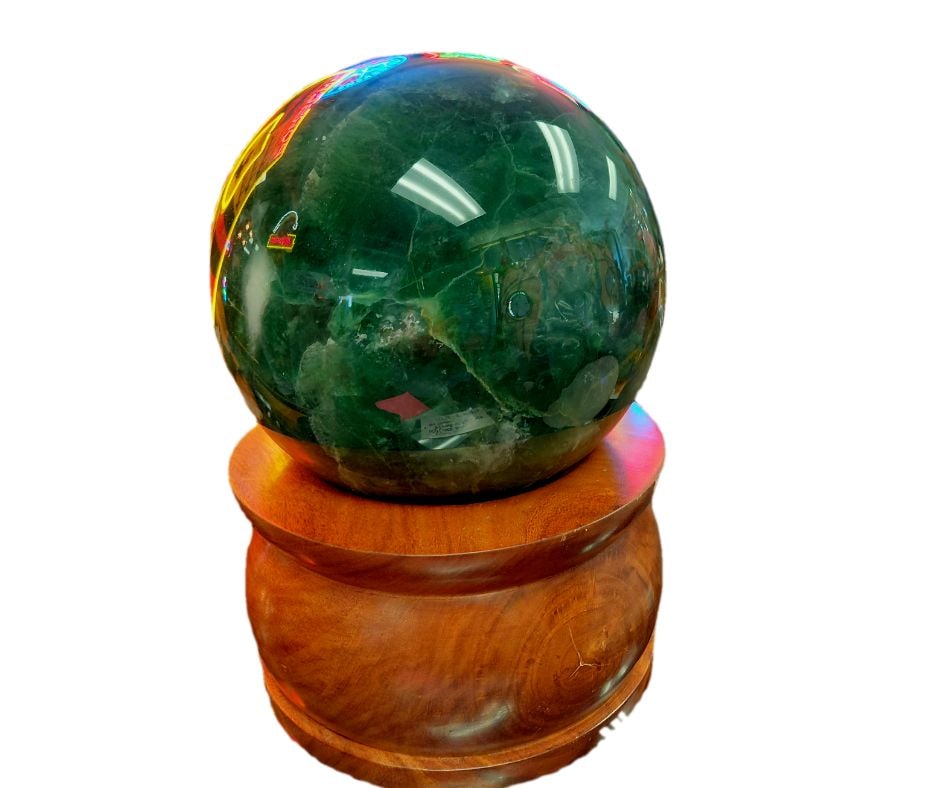 Dark Green Fluorite Sphere on Wooden Display: Dark Green Fluorite Sphere on Display. 10" H x 8"W" x 8"D