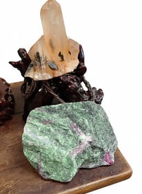 Ruby in Zoisite & pale-orange/peach-colored quartz crystal cluster on Carved Wooden Stand with Rope.