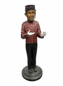 Entry Bellman at entrance of Hotel. Bronze. Signed Ali Matthews Sculpture (8/88).