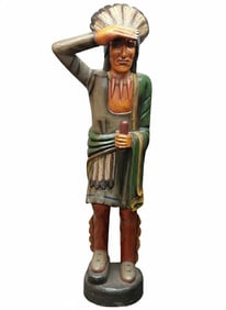 Medium Standing Saluting Cigar Store Advertising Indian with Carved Features. Stands 65"Tall.
