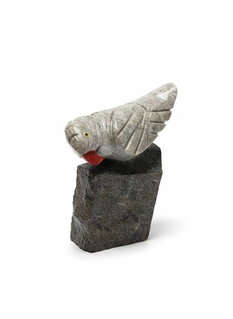 Stone Carved Natural Parrot Atop Granite/Soapstone Rock Formation-Hand carved: Peru Hand Carved Natural Art Comprised of What is believed to be Soapstone/Granite and More Natural Stone Formations.Stone carving of a bird, likely a parrot, mounted on a dark stone base. This form o