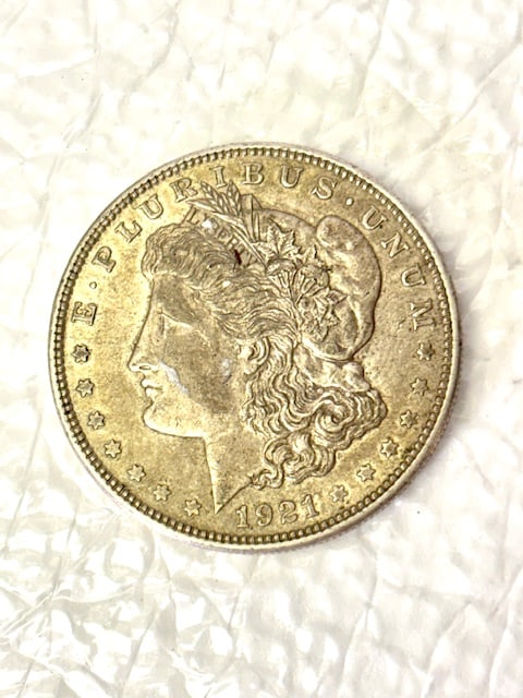 1921 D United States Morgan Silver Dollar | Denver Mint | Final Year of Issue: 1921 D Morgan Silver Dollar struck at the Denver Mint. This historic coin represents the final year of George T. Morgan’s famous design and the only year the Morgan dollar was produced in