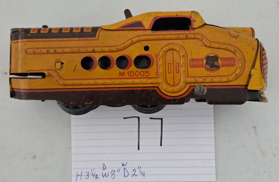 Vintage Yellow Union Pacific M-10005 Tinplate Streamliner Locomotive: Vintage Yellow Union Pacific M-10005 Tinplate Streamliner Locomotive,Classic Marx-style yellow Union Pacific M-10005 streamlined tinplate engine with bold graphics, rivet detailing, and Art Deco