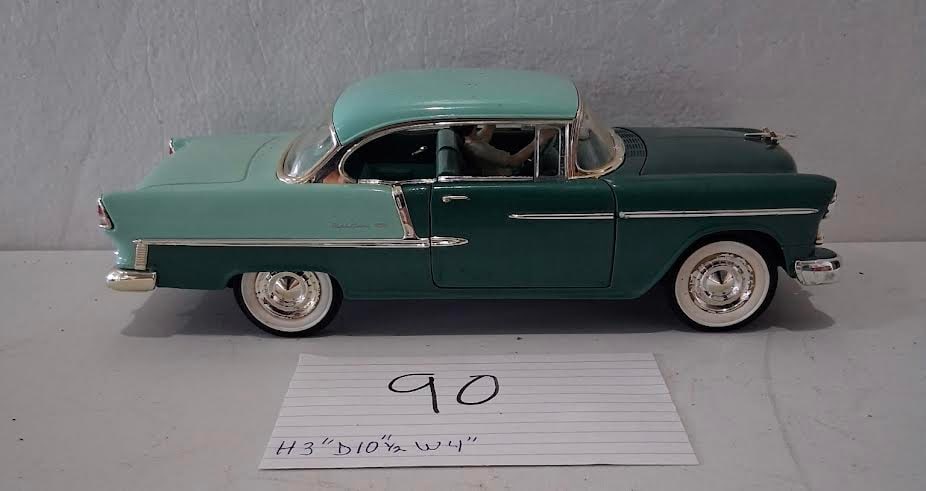 1955 Chevy Bel Air Diecast Model Car: Green and white 1955 Chevy Bel Air-style diecast model car . Approx. 3" H x 10.5" D x 4" W per card. Pre-owned display condition with light wear.