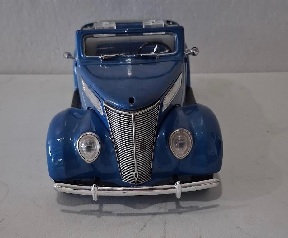 Die Cast Model PT Cruiser: Diecast PT Cruiser, approx. 3.5" H x 10" D x 4" W per card. Pre-owned condition with visible display wear; please review photos.