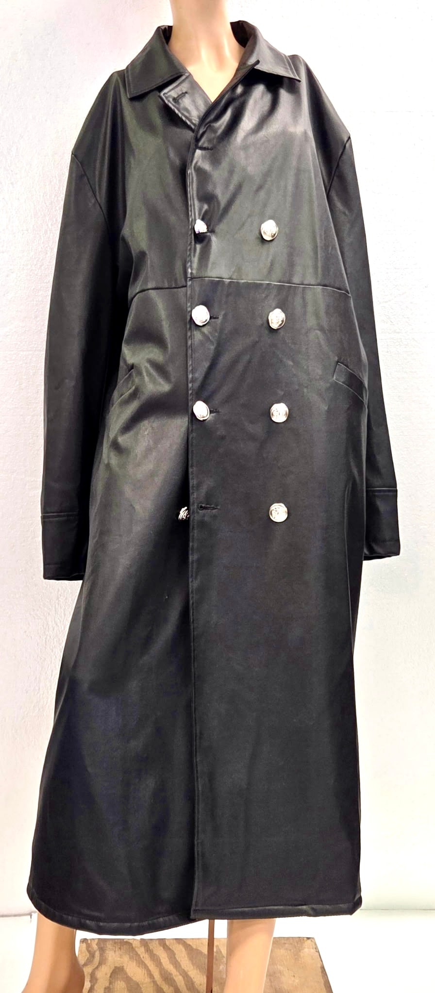 Long Black Leather Trench Coat / Duster with Silver Concho Buttons: Dramatic full-length black leather trench coat/duster featuring large ornate silver concho-style buttons and classic Western cut. Excellent condition with nice leather suppleness. Statement piece for 