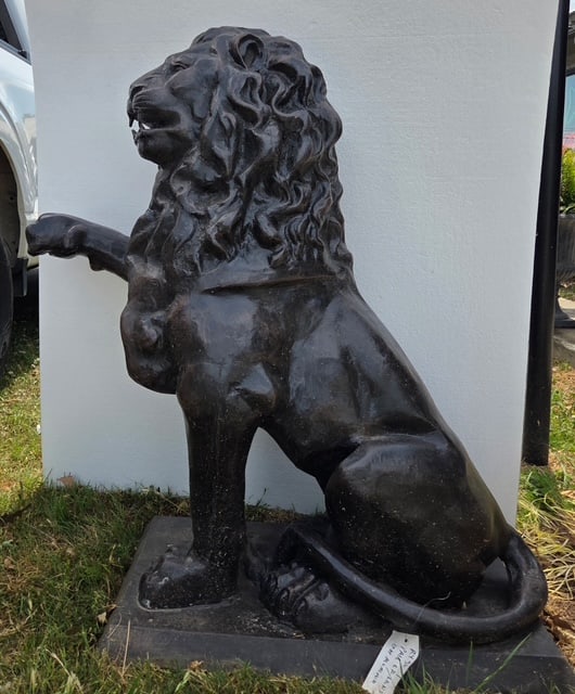 Pair of Cast Aluminum Lions: Pair of Cast Aluminum Lions with raised paws, approx. (46"H x 22"W x 32"D)