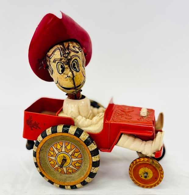 Toy windup car with a cowboy (1 of 8)