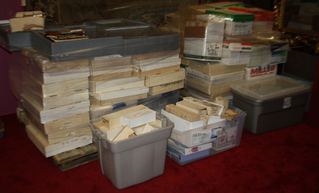 Giant collection of sports cards on 2 large pallets.