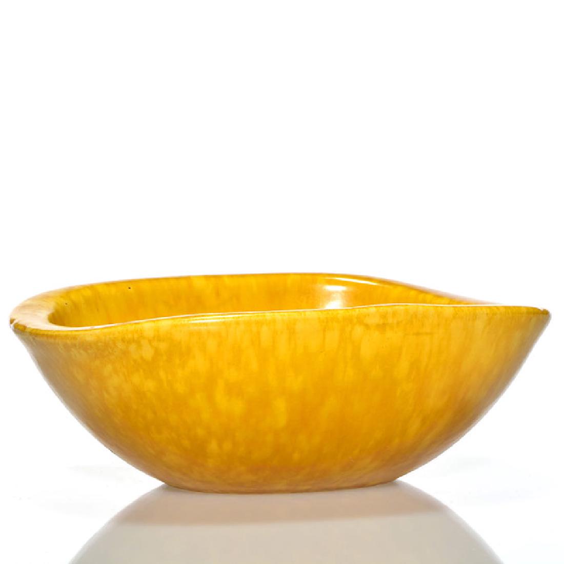 Roseville Raymor Bowl, Gold, 2 7/8 x 8 inches, shape: Roseville Raymor bowl, shape 28-8, in gold. Marked on the bottom Raymor modern artware by Roseville 28-8” USA. There is faint crazing. Size is 2 7/8 inches high by 8 inches wide.