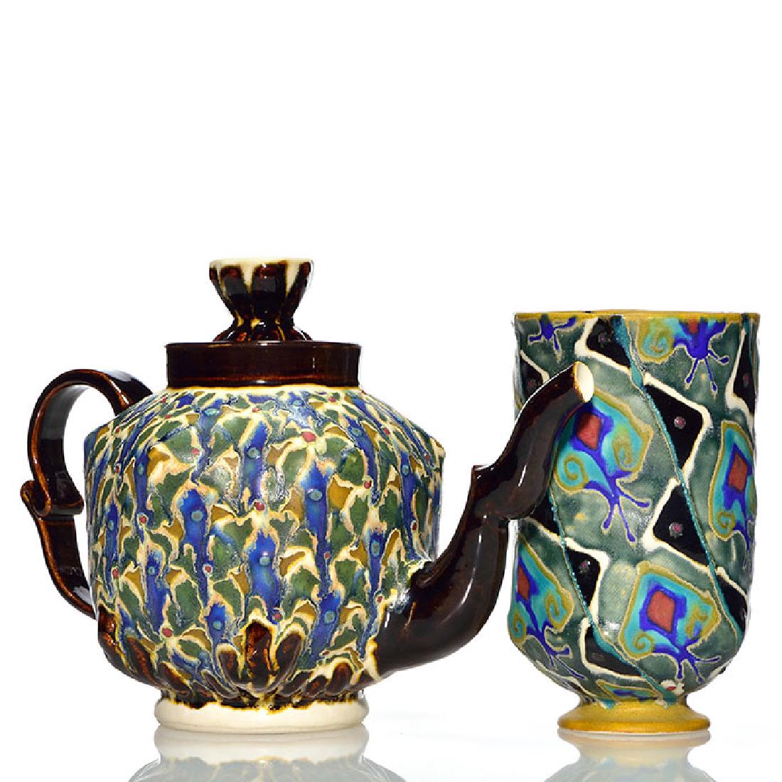 2 Bruce Winn items, teapot and vase, 7 and 8 inches: 2 Bruce Winn items, each colorfully decorated with a combination of mat and high glazes. The vase is 7 inches and is incised Winn ‘89 on the bottom. The 8 inch tea pot with lid is incised Winn ‘92