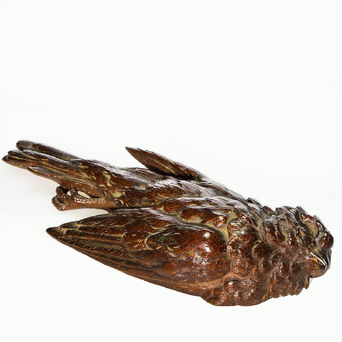 Bronze lifeless bird paperweight, 6 inches, plaster: Bronze paperweight of a lifeless bird, measuring 1 inches by 6 inches long. Unmarked. Plaster filling. Nice patina.