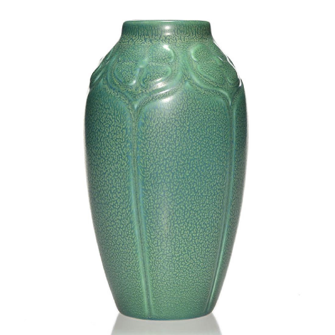 Rookwood production vase, green-blue glaze, 1928, 7 1/8: Production vase with molded floral design, cast in 1928 and covered with green over blue mat glazes for a great frog-skin effect. Marks include the Rookwood logo, date and shape 2403. Excellent origin