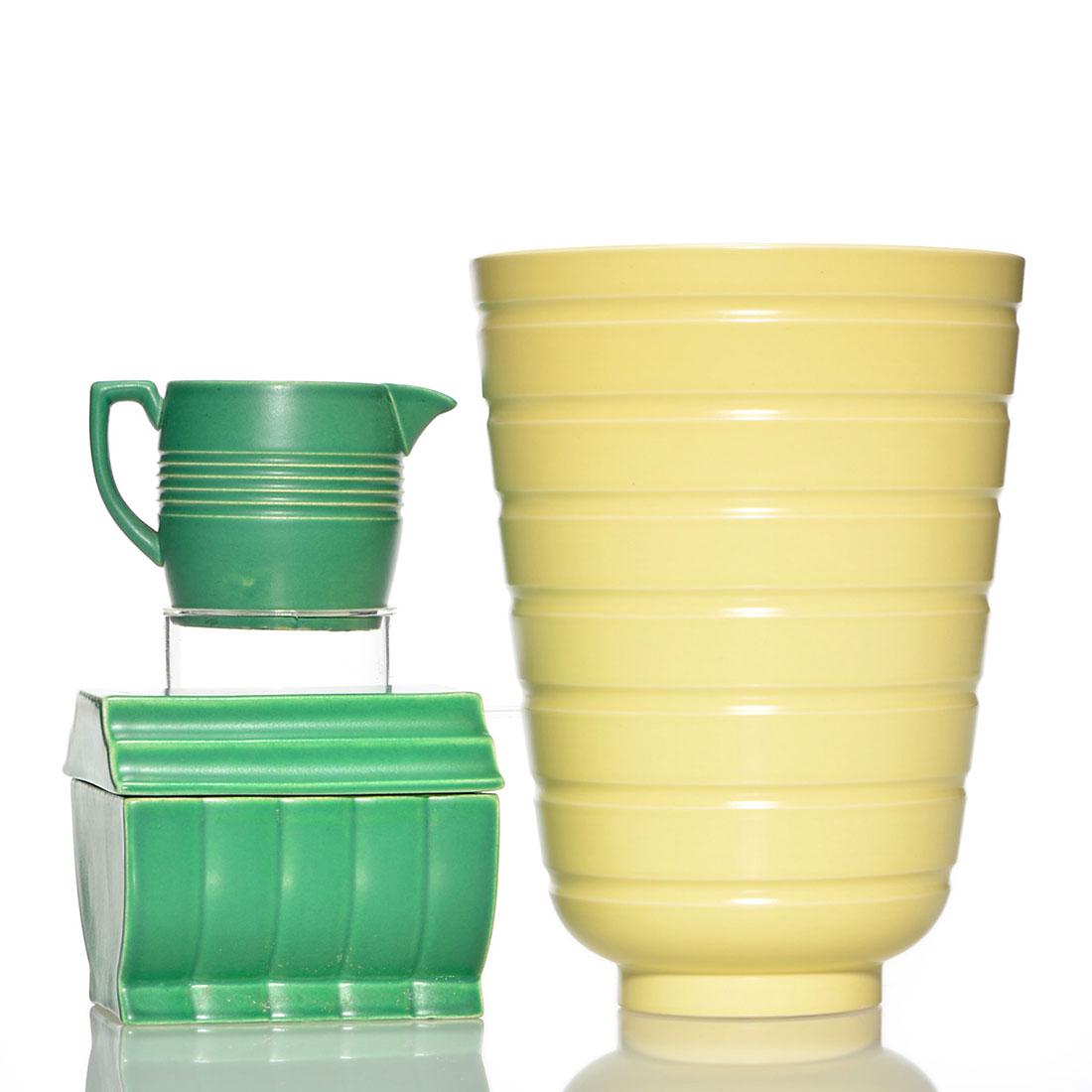 3 Wedgwood Keith Murray, vase, lidded box,creamer,7 1/2: Three Wedgwood items designed by Keith Murray. 1) Ribbed vase in light yellow. Height is 7 1/2 inches. There is a tight 1/2 inch line descending from the rim. 2) Creamer, 2 1/2 inches high, green mat,
