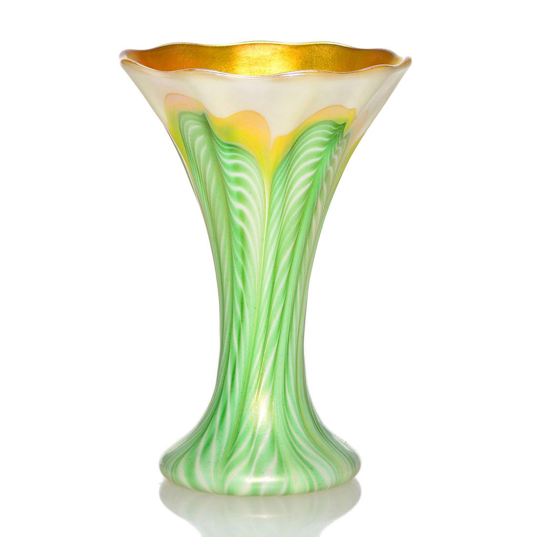Quezal miniature vase, pulled leaves, ribbed, 4 3/8": Quezal miniature flower form vase with green feathers combed from the base tipped in gold. Wonderful ribbed body and a bright gold interior with just a touch of magenta. Height 4 3/8 inches. Engraved 