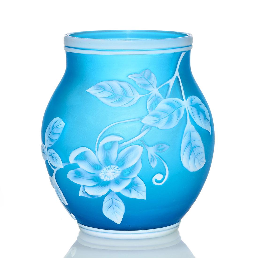 Thos.Webb & Sons cameo miniature vase, blue, floral: Thomas Webb & Sons English cameo small vase in Prussian blue with a white flowering vine. Height 3 7/8 inches. Impressed Webb within sun ray logo. Excellent beautiful condition.