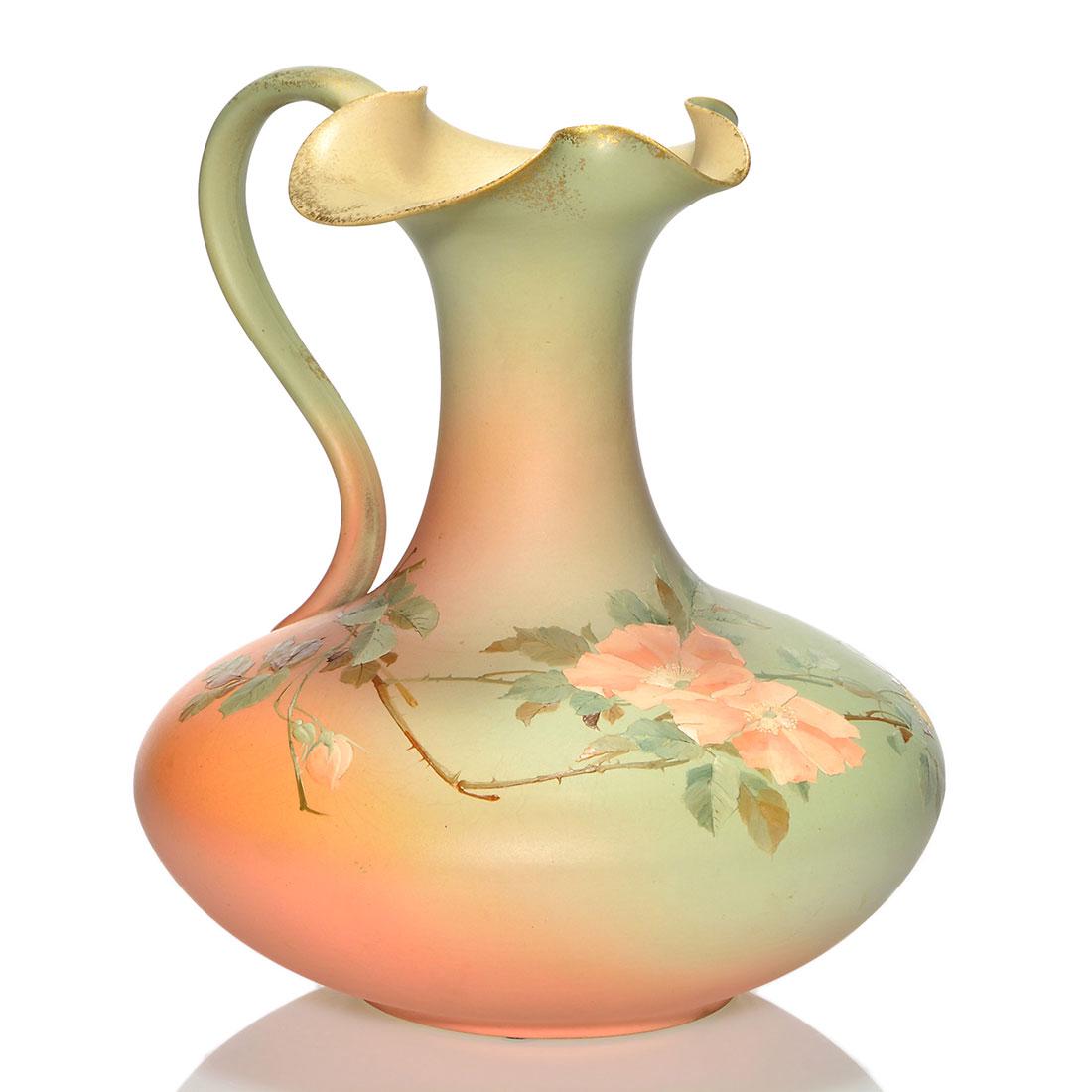 Rookwood Dull Finish ewer, wild roses, A.R.V. 9 3/4": Dull Finish ewer decorated with wild roses and having fired on gold highlights, the work of Albert Valentien in 1889. Marks include the Rookwood logo, which indicates the date, shape 495 A, an impress