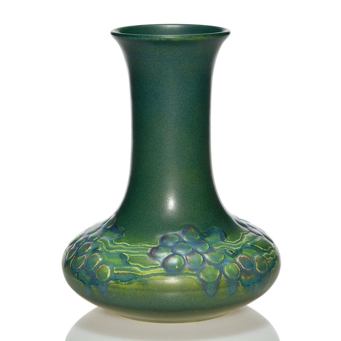 Rookwood carved mat, Todd, grapes, 1914, 9 3/4": Mat glaze vase with a carved and painted design of grapes, the work of Charles Todd in 1914. Marks include the Rookwood logo, date, shape 670 C and Mr. Todd's incised initials. There is faint crazing 