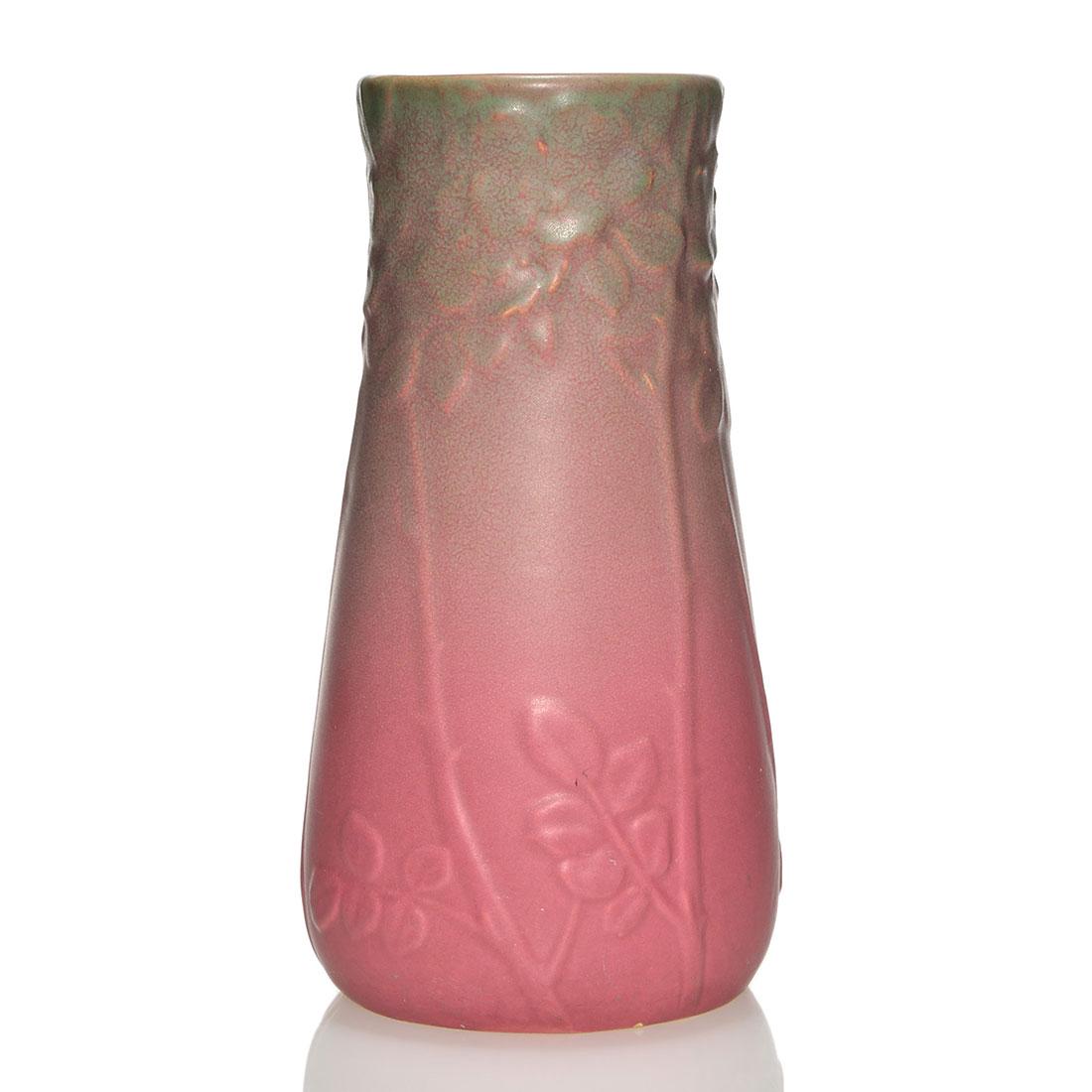 Rookwood production vase, 1914, 1709, floral, 10 1/4": Production vase with molded floral decoration, cast in 1914 and covered with green over rose mat glazes. Marks include the Rookwood logo, date and shape 1709. There is fine crazing, minor penciling an