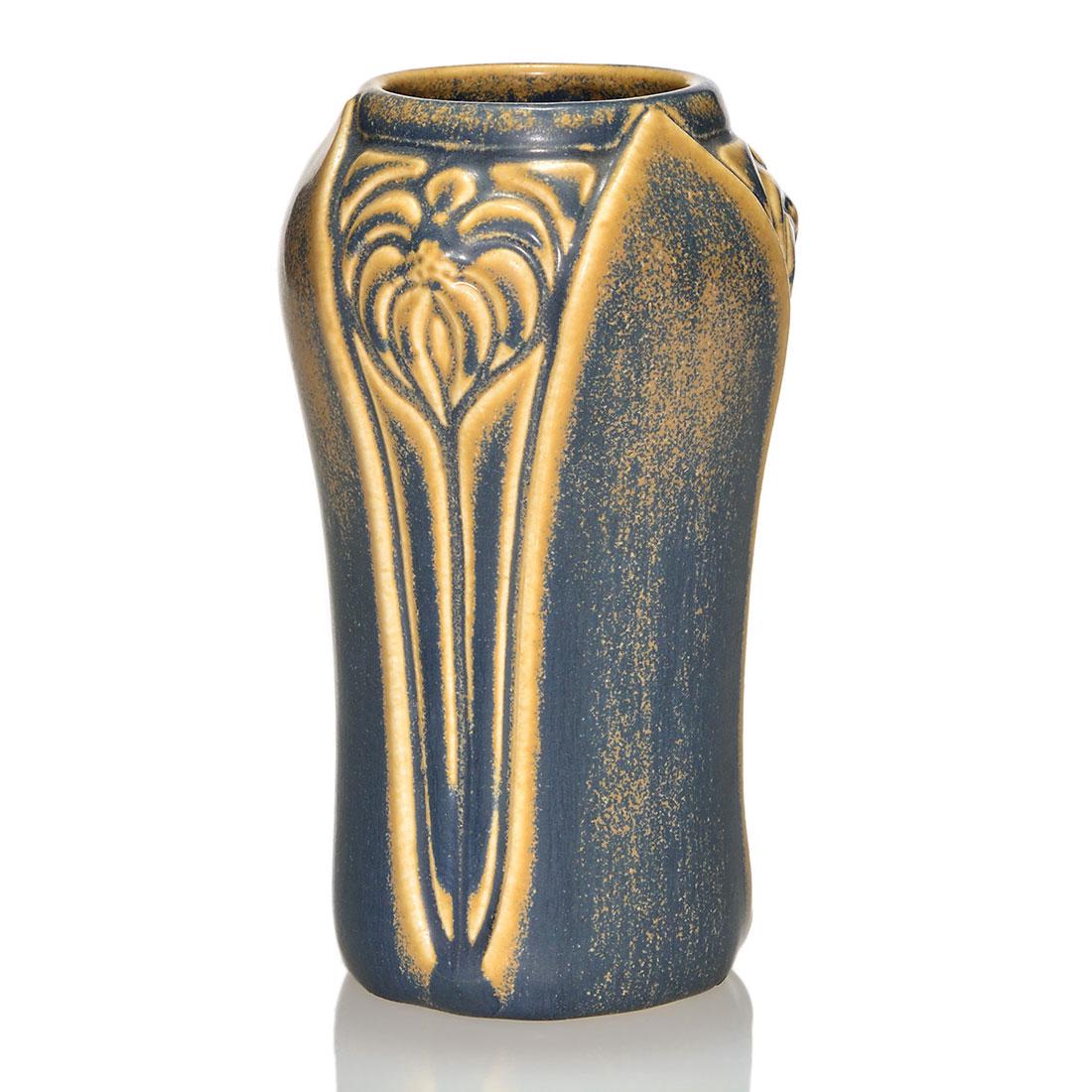 Rookwood production vase, blue over tan, 1927, 2141, 6: Production vase with molded floral design, cast in 1927 and covered with the blue over tan mat glaze combination. Marks include the Rookwood logo, date and shape 2141. There is a tiny glaze nick near