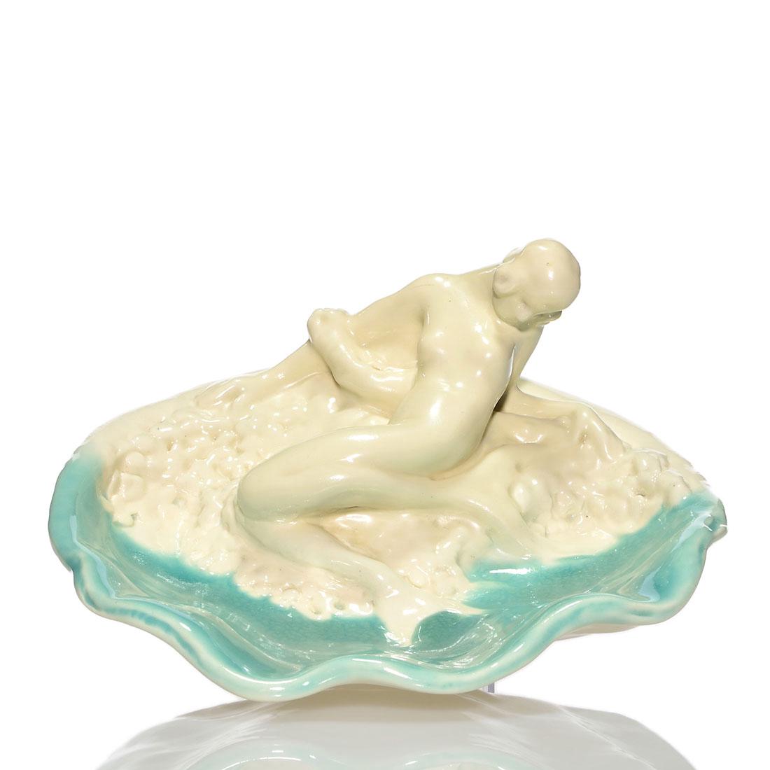 Rookwood Porcelain mermaid bowl, 1917, 2252, 4 5/8" x 9: Rare porcelain shell bowl with a reclining mermaid, cast in 1917 and covered with ivory and turquoise high glazes. Marks include the Rookwood logo, date, shape 2252 and a sideways P for Soft Porcelain