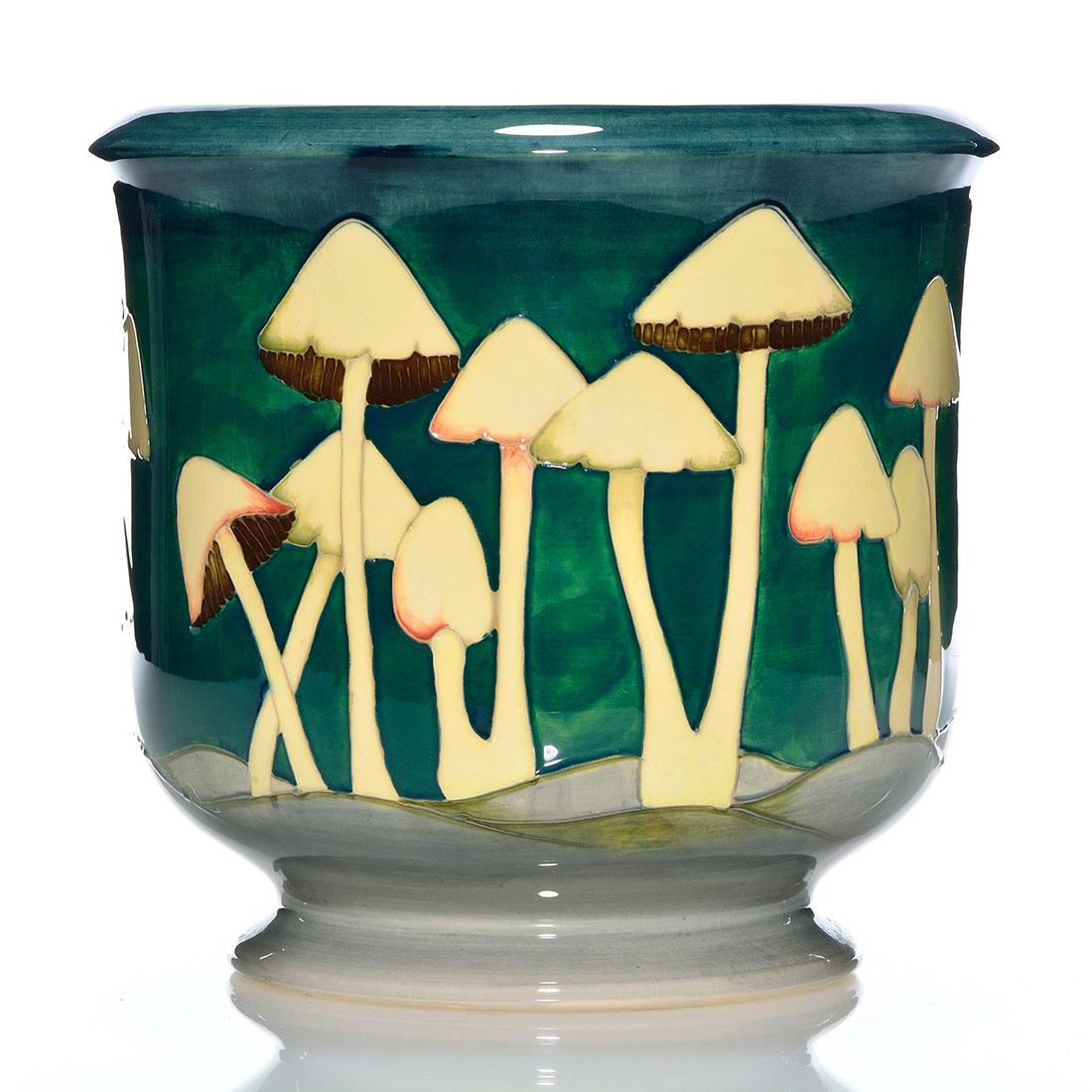 Moorcroft contemporary jardiniere, mushrooms, 8 3/4": Contemporary (circa 1989) Moorcroft jardiniere with mushrooms encircling the piece. Stamped on the bottom MOORCROFT, MADE IN ENGLAND and painted signature of William Moorcroft (WM) in green slip. Deco