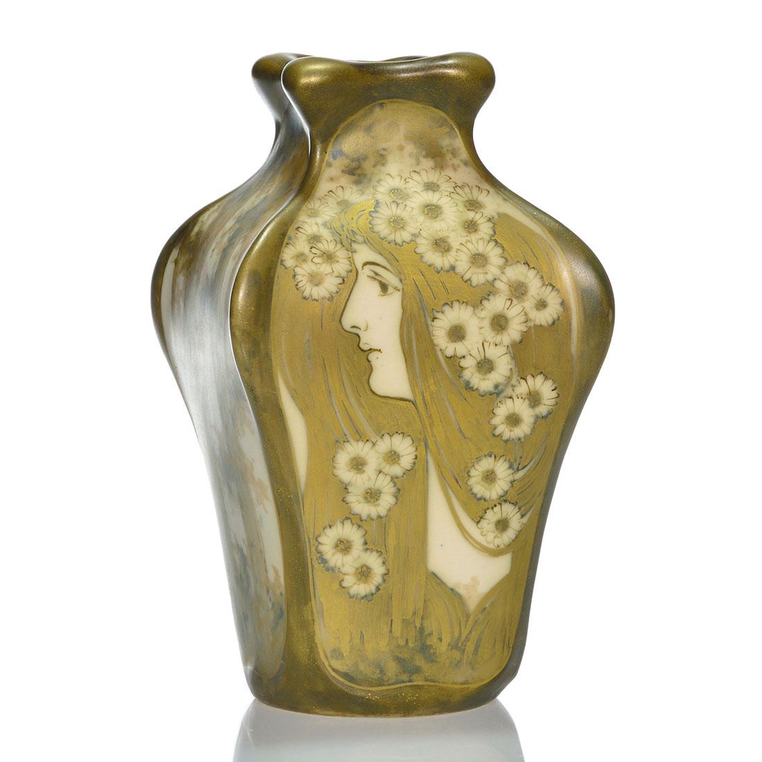 Amphora (R.St.&K) vase, woman and daisies, 8 1/2": Amphora (Reissner, Stelmacher & Kessel) four sided vase with the visage of a maiden with daisies in her hair on one side and groves of trees on the remaining sides. Measures 8 1/2 inches by 5 inches a