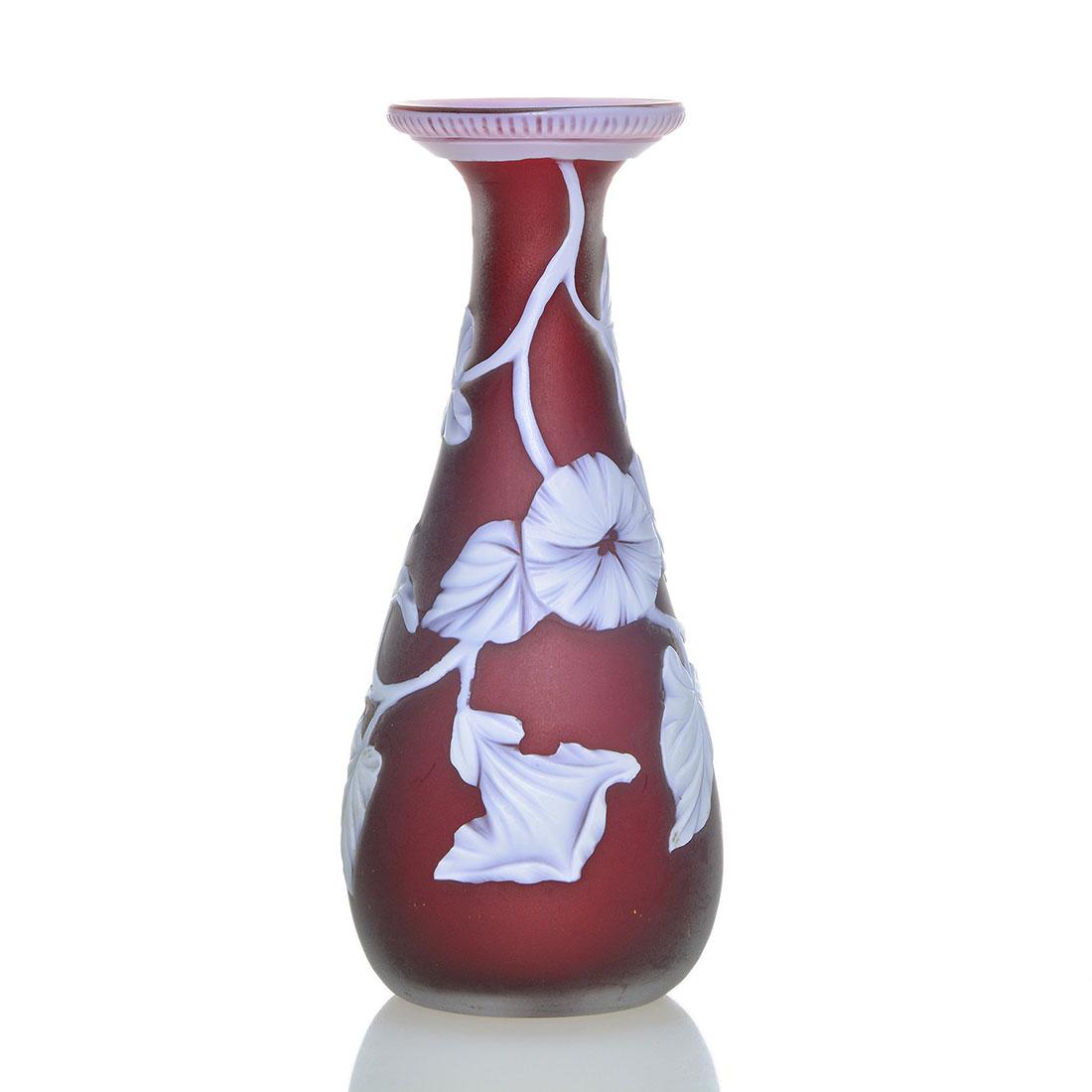 T. Webb & Sons attrib miniature cameo vase, 3 1/2": Thomas Webb & Sons miniature cameo vase in attribution. The ruby teardrop form surrounded by a white morning glory vine, the flaring rim with decorative trim. Height 3 1/2 inches. Bold and showy for s