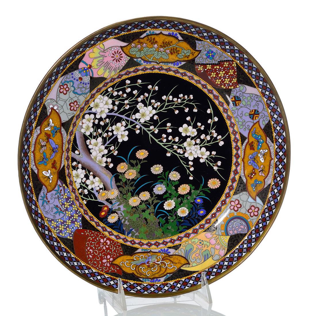 Japanese cloisonne charger, floral,butterflies, 11 3/4": Good Japanese Cloisonne' enamel charger, centered with a cherry tree bountiful of bloom and surrounded by lush daisy plants. The border is lavished with highly decorative swatches overlaid with four g