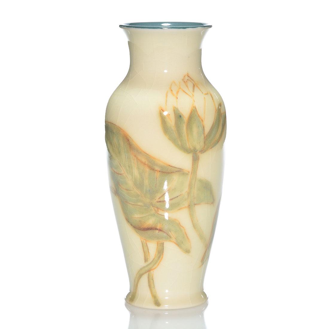 Rookwood Porcelain vase, water lilies, Jensen, 9": Porcelain vase decorated with water lilies, the work of Jens Jensen in 1945. Marks include the Rookwood logo, date, shape 6866, Mr. Jensen's monogram and 8402 in brown slip. There is broad, even crazi