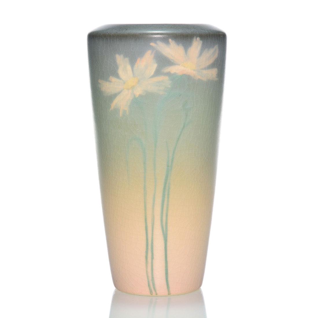Rookwood Vellum floral, McDermott, 1915, 2101,7 1/4": Vellum vase with daisy decoration done in 1915 by Elizabeth McDermott. Marks include the Rookwood logo, the date, shape number 2101, an impressed V and the incised monogram of the artist. Height 7 1/4
