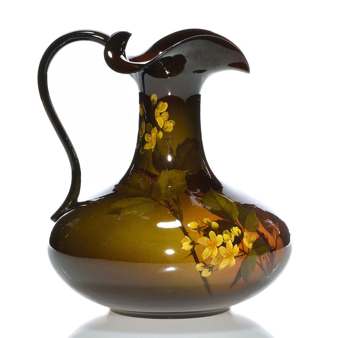 Rookwood Standard ewer,Daly,1896,495 A,floral, 9 1/8": Standard glaze ewer decorated with a flowering blackberry bush, the work of Matthew Daly in 1896. Marks include the Rookwood logo, which indicates the date, shape 495 A and Mr. Daly's incised initials