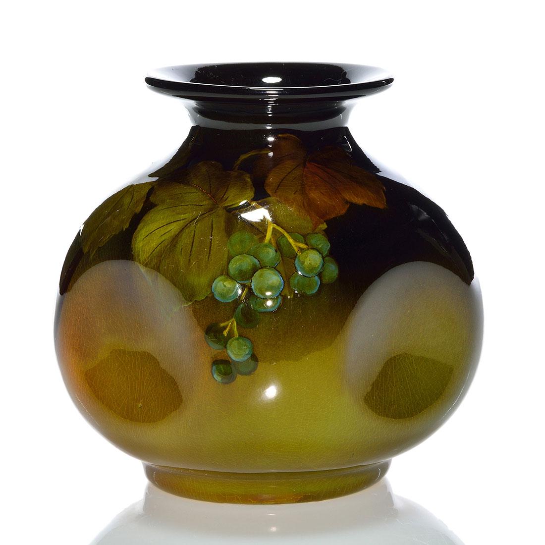 Rookwood Standard glaze vase,Perkins,1897,717,5 1/8": Standard glaze vase with woodbine decoration painted by Mary Louella Perkins in 1897. Marks include the Rookwood logo, which indicates the date, shape 717, a diamond shaped esoteric mark and Ms. Perki
