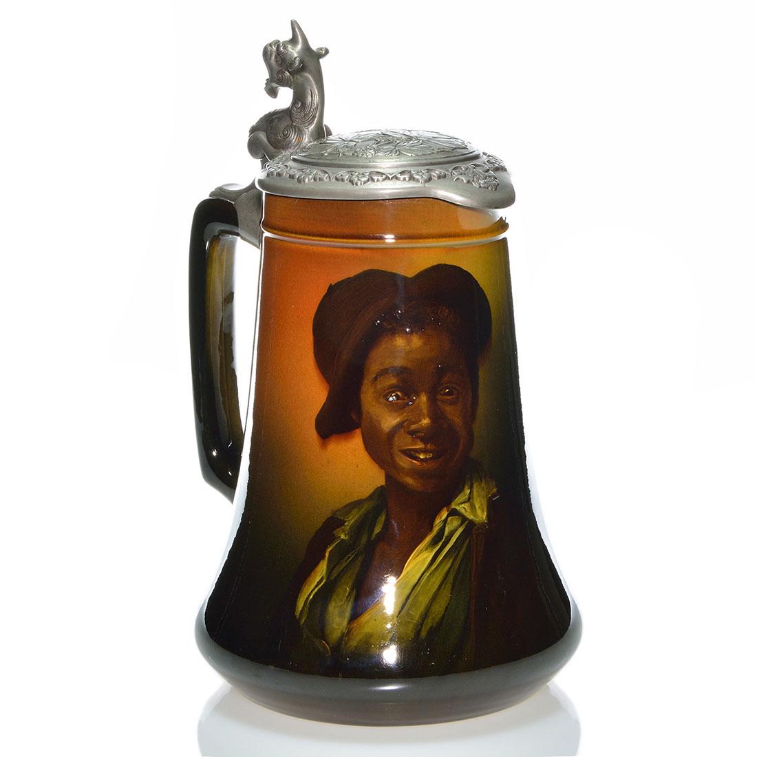 Rookwood SG stein,Black youth,Horsfall,1895,12 1/4",656: Standard glaze stein with portrait of a young African American lad with cloth hat, the work of Bruce Horsfall in 1895. Marks include the Rookwood logo, which indicates the date, shape 656 and Mr. Hors