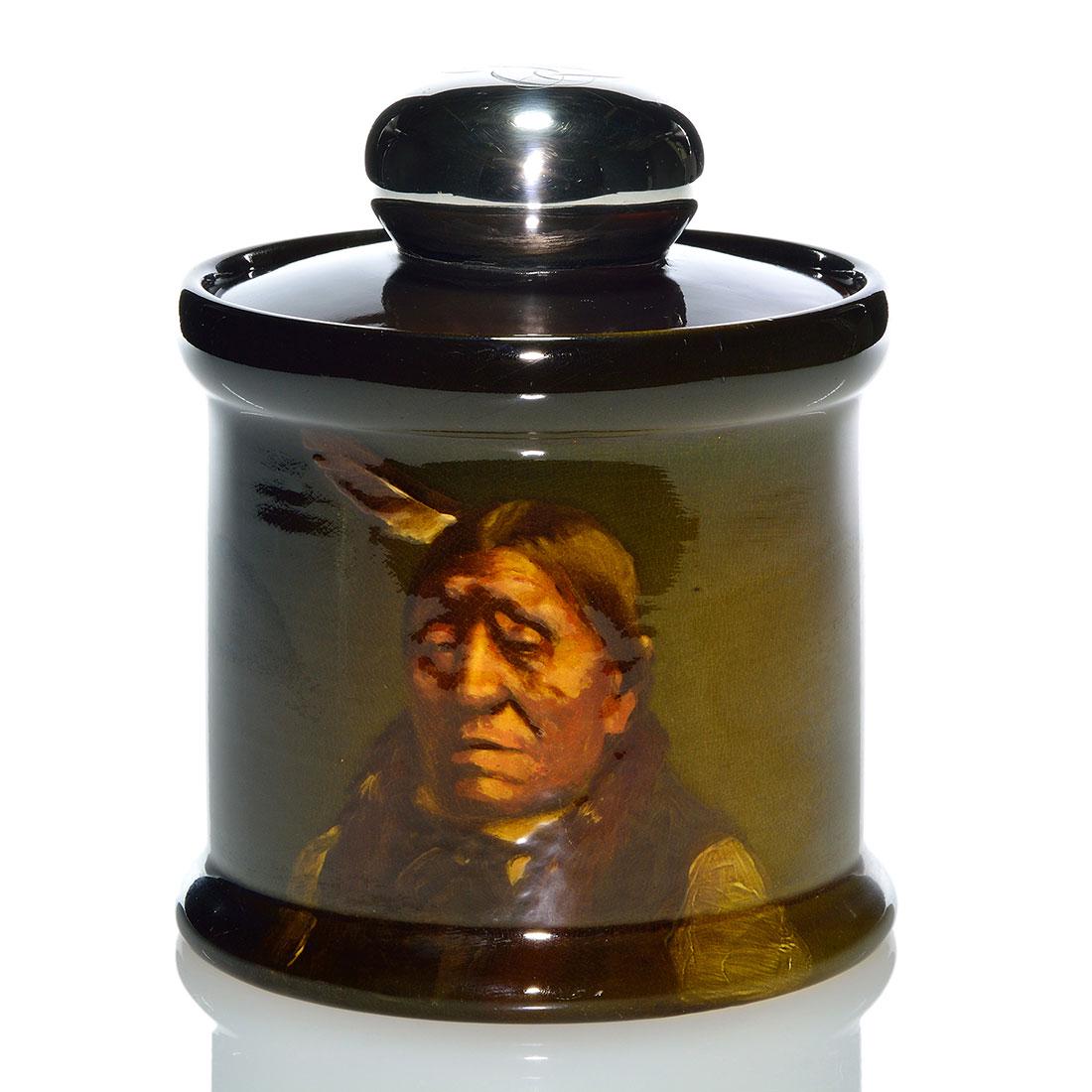 Rookwood Humidor, Native American, Young, 1898, 801, 7": Standard glaze humidor decorated with the portrait of a Native American done by Grace Young in 1898. Marks include the Rookwood logo, which indicates the date, shape 801, a star shaped esoteric mark, 