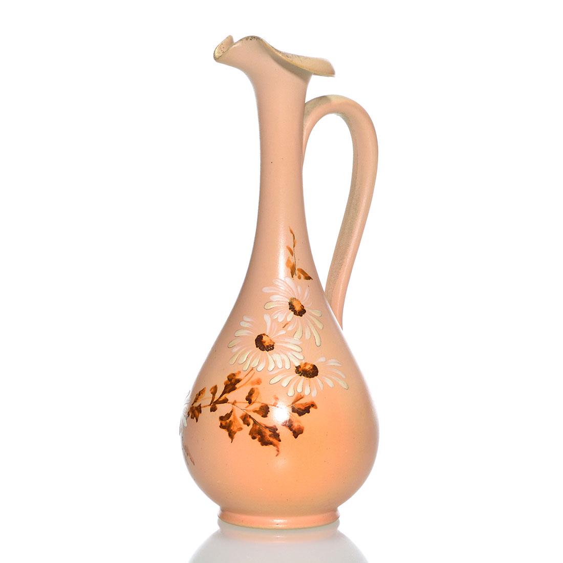 Rookwood 1888 Dull Finish 6 3/4" ewer, daisies, 381 C: Dull Finish ewer with white daisies and brown leaves on a pink ground and accented at the rim with a bit of fired-on gold, the work of an unknown decorator in 1888. Marked with the Rookwood logo, whic