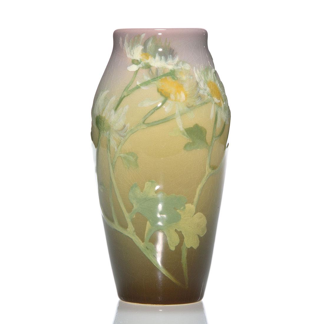 Rookwood Iris glaze vase,Bishop,1903,925 E,6 1/2": Iris glaze vase decorated with daisies, the work of Irene Bishop in 1903. Marks include the Rookwood logo, date, shape 925 E, an incised W for White (Iris) glaze and Ms. Bishop's incised monogram. The