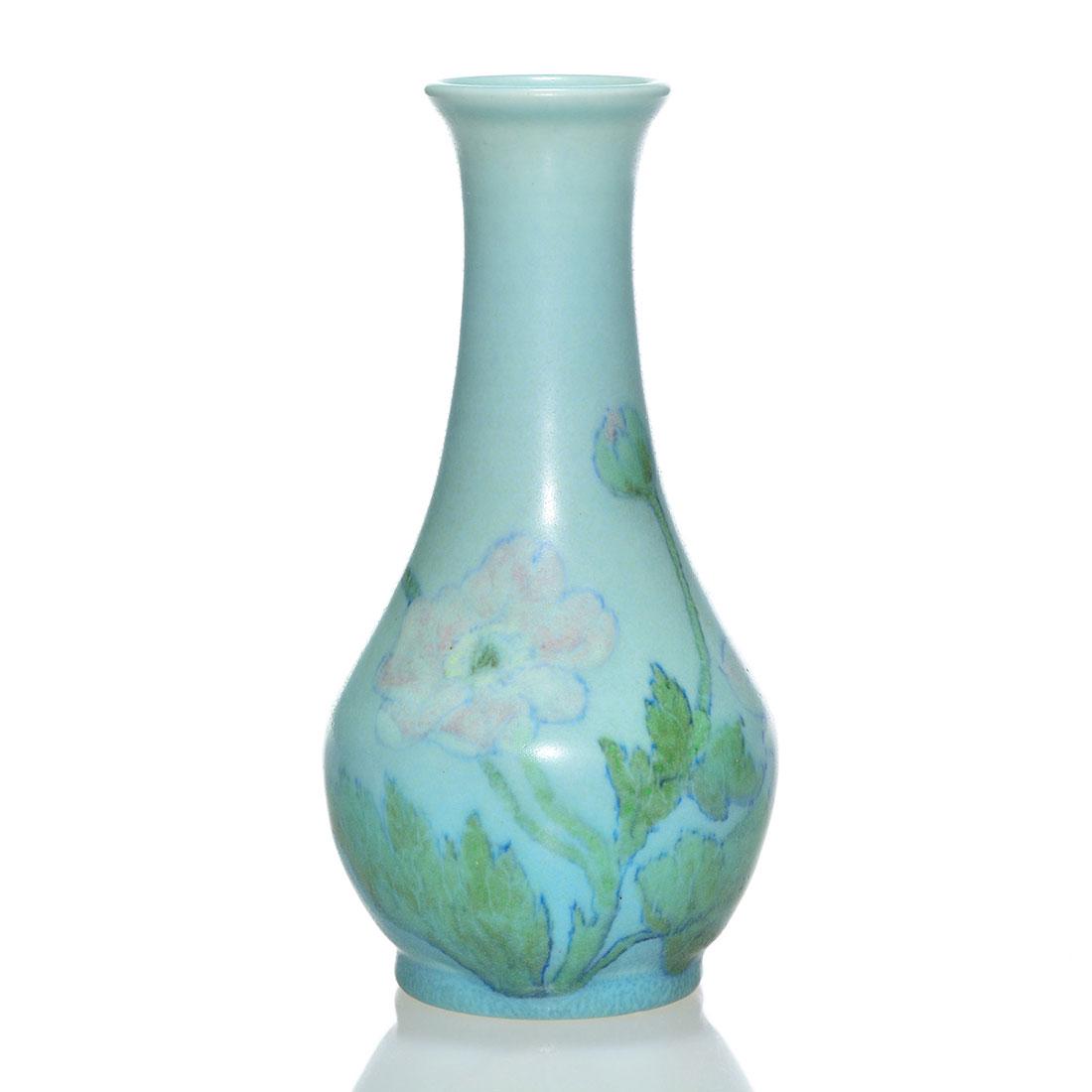 Rookwood vellum vase, poppies, Pullman, 1928, 7 1/2": Vellum vase with pastel pink poppies and green foliage painted by John Wesley Pullman. Height 7 1/2 inches. Impressed with the factory logo, 1928 date, 2963 shape and the painted monogram of the artis