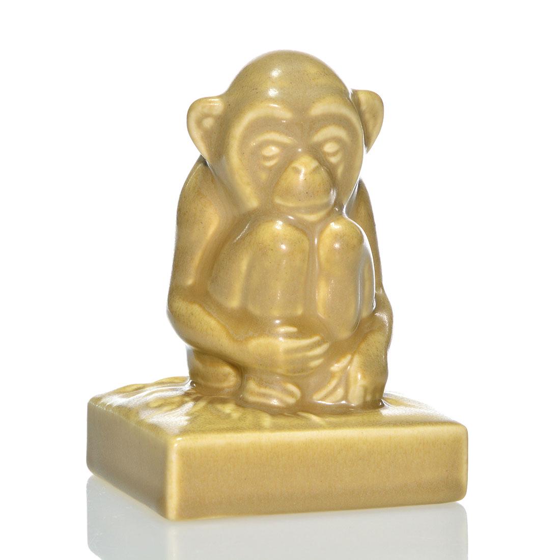 Rookwood Monkey on plinth pw, 1935, tan, 6426, 4 5/8": Monkey on plinth paperweight, a Shirayamadani design, cast in 1935 and covered with a tan mat glaze. Marks include the Rookwood logo, date and shape 6426. Excellent original condition. Height is 4 5/8