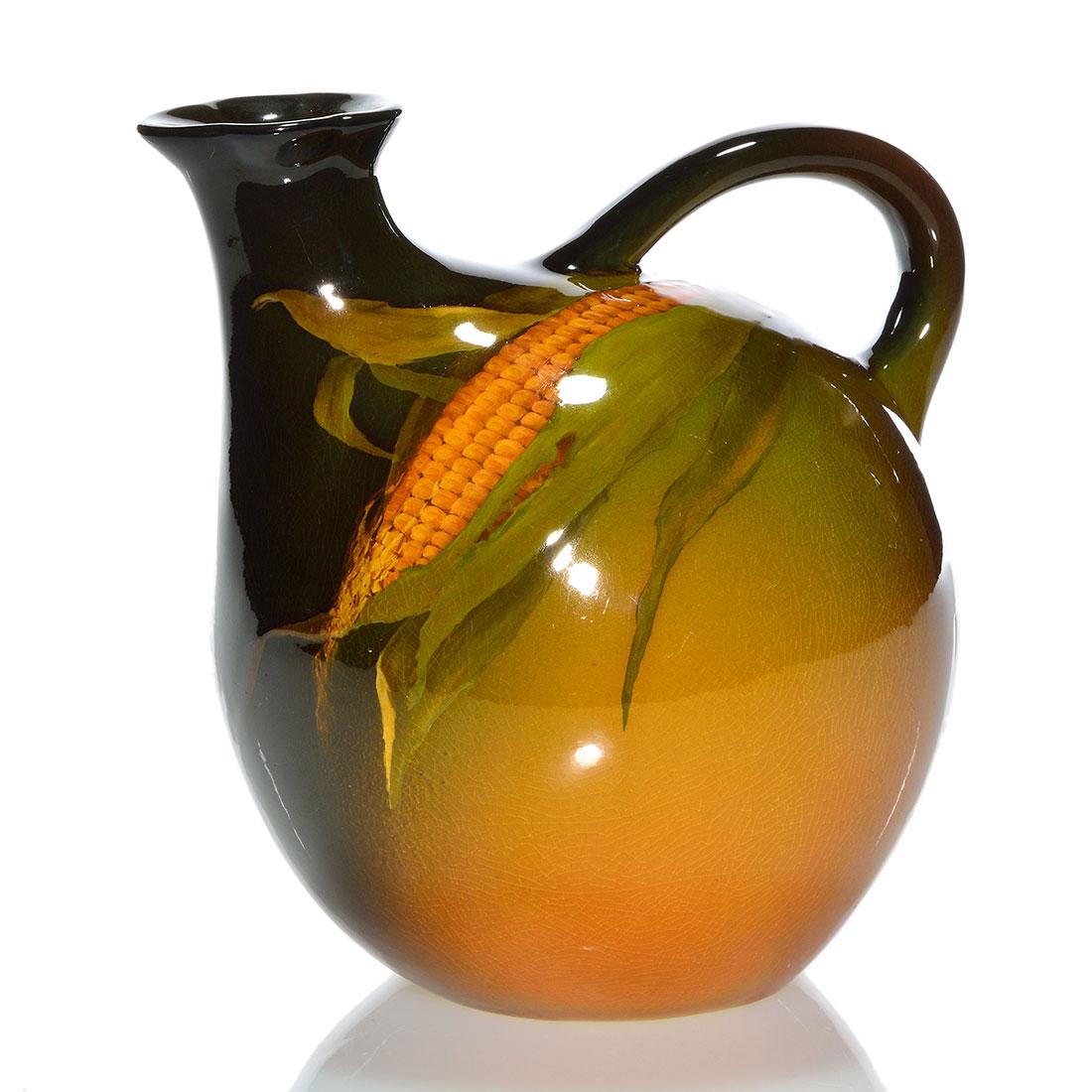 Rookwood Standard whiskey jug, Coyne, corn,1897, 6 1/4": Standard Glaze 6 1/4 inch whiskey jug, decorated in 1897 by Sallie Coyne, who used a ripe ear of corn as her subject. Marked with the Rookwood logo, which provides the date, shape 694 and the artist's