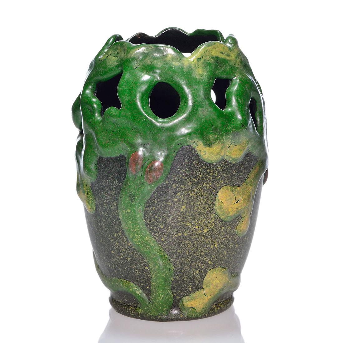 Michael Andersen & Son reticulated vase, trees 7 1/4”: Arts & Crafts style Michael Andersen & Son vase with swaying olive trees applied to the body and reticulation within the foliage. Height 7 1/4 inches. Marked with an early Michael Andersen mark. Excel