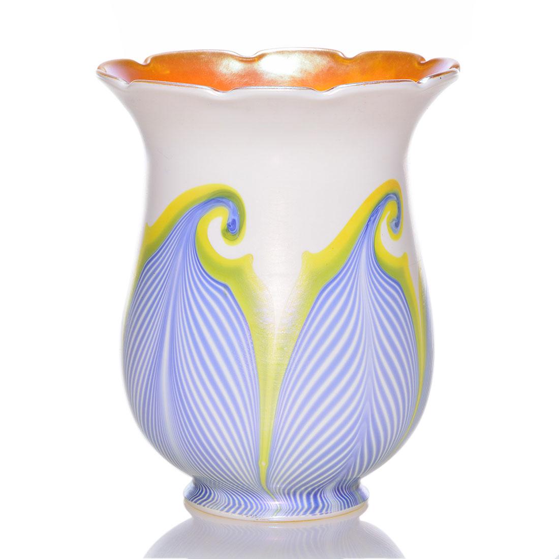 Quezal shade, blue hook & scroll feather, gold,5 1/8": Quezal shade with coiled blue feathers bordered by gold over a pearly white. Yellow gold interior. Slight scalloped lower rim. Height 5 1/8 inches. The 2 3/8 fitter bears the company’s engraved sign