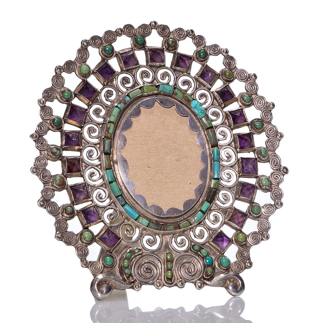 Matl Taxco silver frame, turquoise,amethyst, 4 3/4": Matilde Eugenia Poulat, Mexican silver frame with easel back adorned with turquoise inlays and polished amethyst stones. Measures 4 3/4 inches by 4 3/8 inches across. The easel is impressed Matl, M.RE