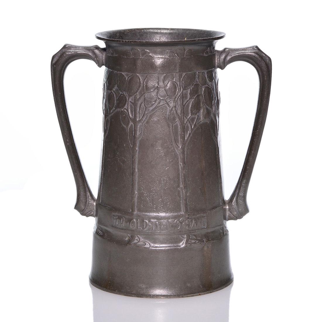 Liberty Tudric “Old Times Sake ” loving cup, 8”,: Early David Veasey Liberty & Company Tudric pewter “reminiscent” loving cup with Lunaria money plants in relief, for luck & prosperity and a banner reading “For Old Times Sake” across the fron