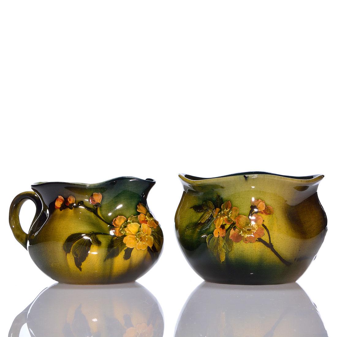 Rookwood Standard Creamer & Sugar, 1892, 330, 2 7/8": Standard glaze creamer and sugar with wild rose decoration done 1892. Marks include the Rookwood logo, which indicates the date, shape 330 and an impressed W for White clay. There is no artist signatu