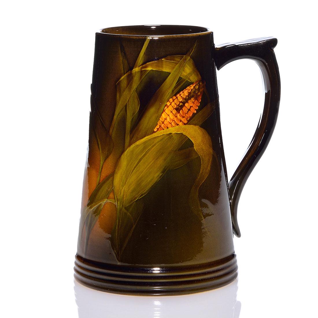 Rookwood Standard mug, corn, Nourse, 1897,775, 7 1/4": Standard glaze mug decorated with an ear of corn painted by Mary Nourse in 1897. Marks include the Rookwood logo, which indicates the date, shape 775 and the artist's incised monogram. There is fine o
