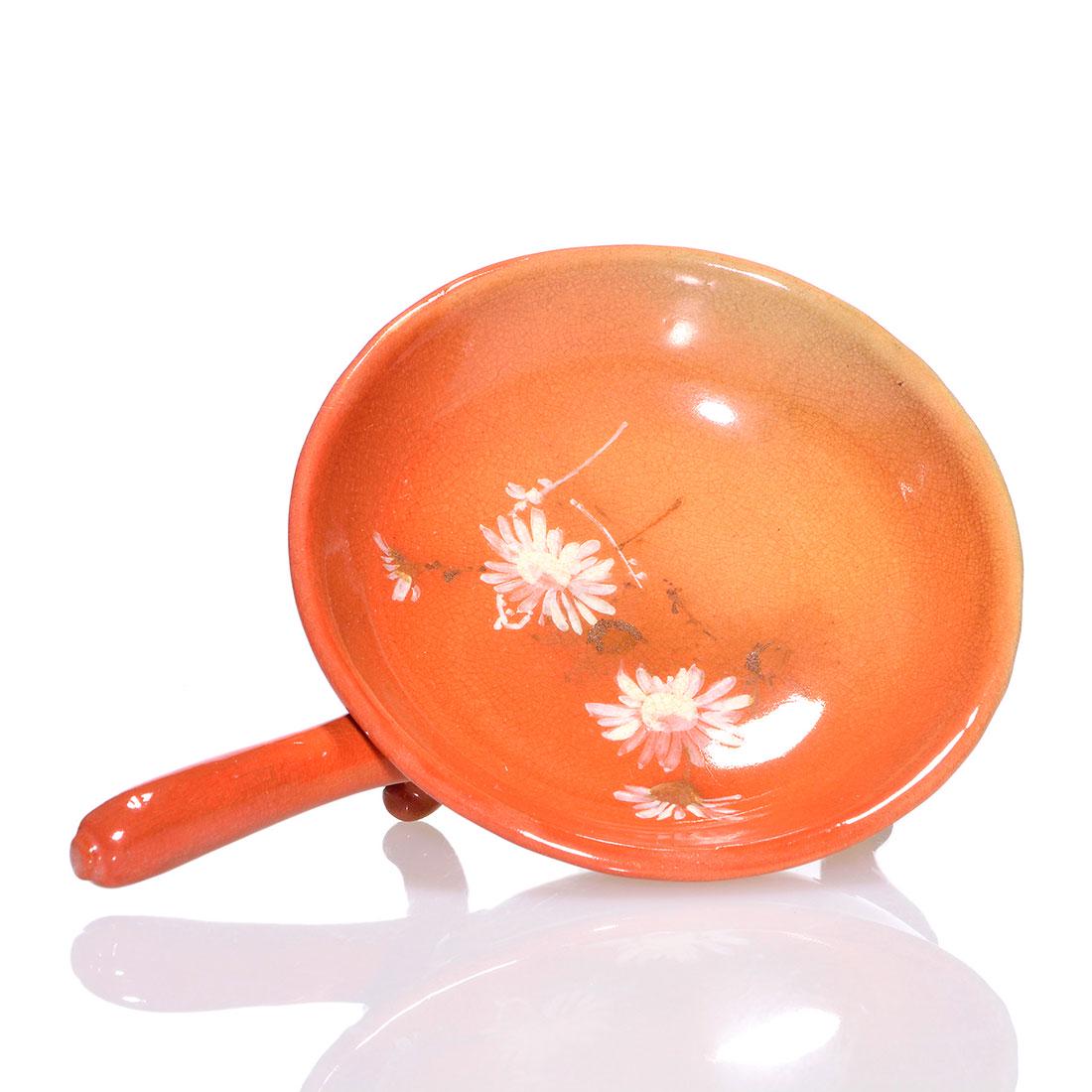 Rookwood Cameo footed bowl,Toohey,1892,1 3/4": Cameo glaze footed bowl with handle, decorated with daisies painted by Sallie Toohey in 1892. Marks include the Rookwood logo, which indicates the date, shape 198, an impressed W for White clay and Ms