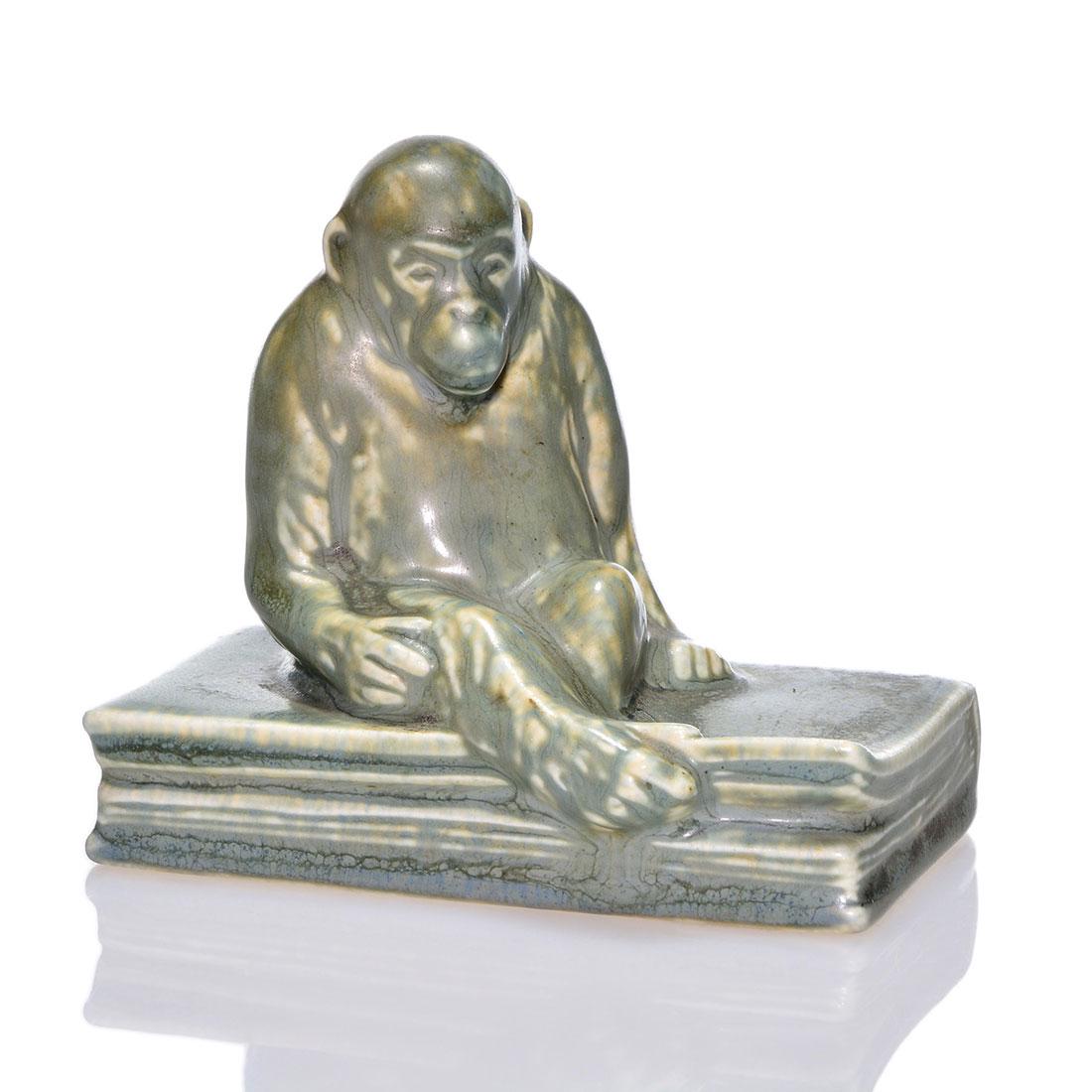 Rookwood Monkey on Book pw, mat, 1929, 2677, 3 5/8": Monkey on Book paperweight, a Shirayamadani design, cast in 1929 and covered with gray over tan mat glazes. Marks include the Rookwood logo, date and shape 2677. Excellent original condition. Height i