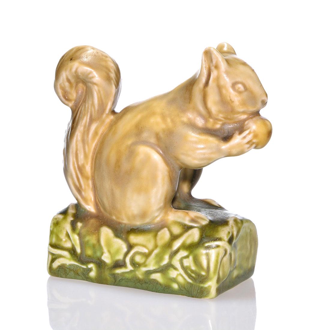 Rookwood polychromed Squirrel PW, 1928, 6025, 4 1/4": Squirrel paperweight, a Sallie Toohey design, cast in 1928 and covered in multiple mat glazes. Marks include the Rookwood logo, date, shape 6025 and Ms. Toohey's mold monogram. Excellent original cond